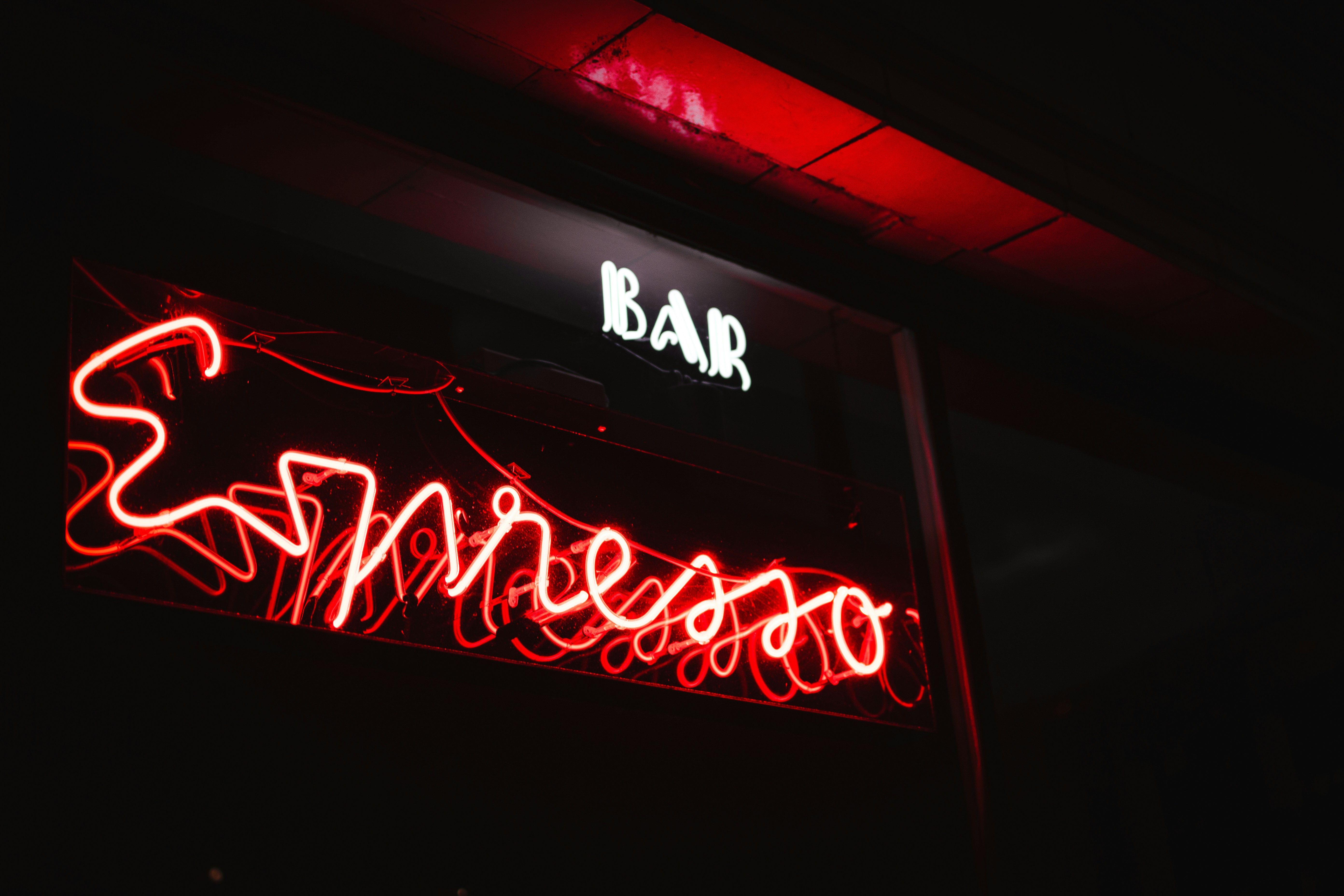 red and white UNKs neon light signage